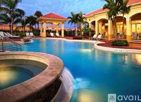 A pool with a hot tub in the middle of it.