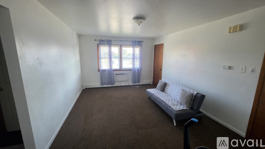 A room with a bed and a window.