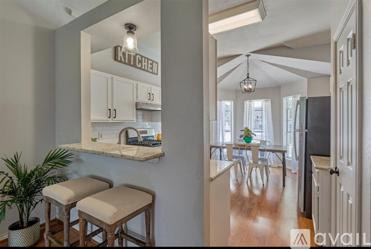 A kitchen with a counter and a plant.