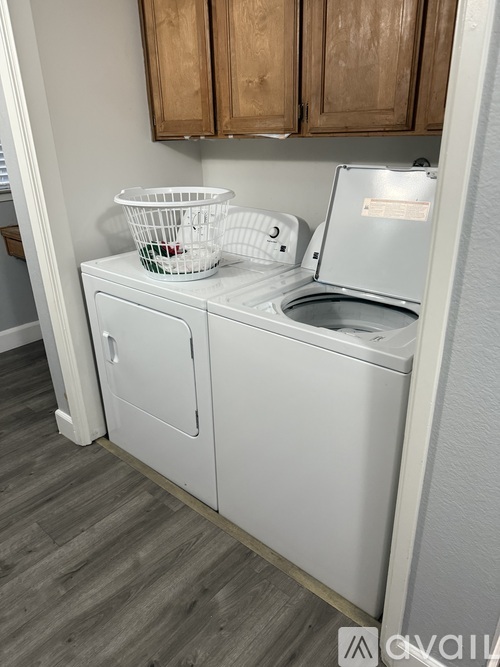 A white dishwasher with a basket on top of it.