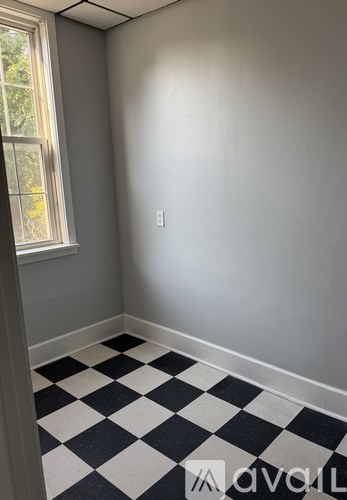A room with a black and white checkered floor.