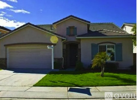 A house with a white garage door and a brown roof.