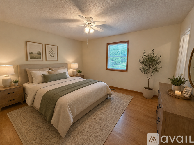 A bedroom with a large bed and a window.