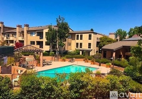 A large house with a pool in the backyard.