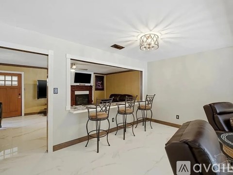 A dining room with a table set for six.