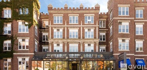 A large red brick building with a glass entrance.