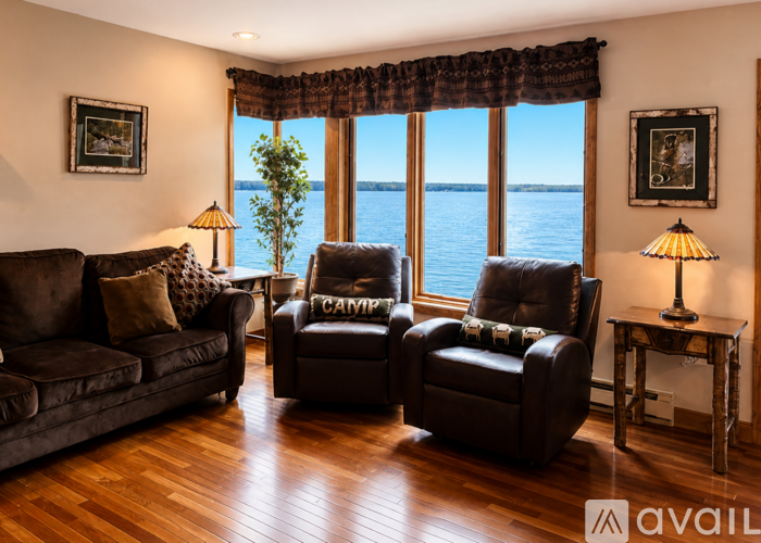 A living room with a view of the water.
