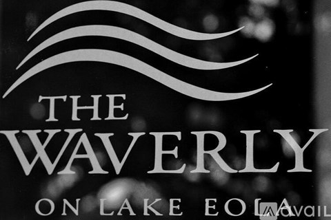 A black and white image of a sign that reads "The Waverly on Lake EO.".