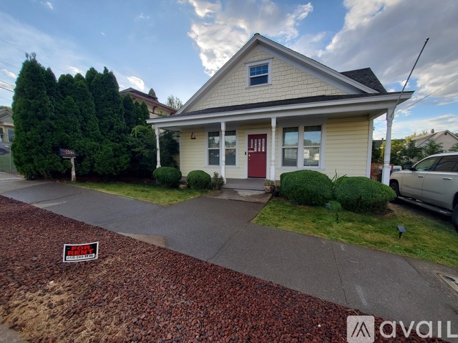 A house with a red door is for sale.