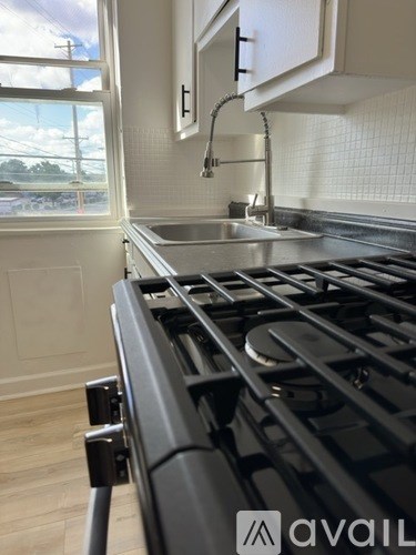 A modern kitchen with a stainless steel stove top.