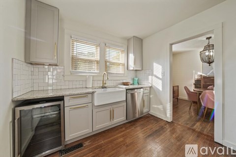 A kitchen with a stainless steel dishwasher and oven.