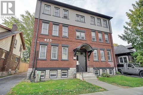 A brick building with the number 425 on the front.