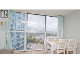A dining room with a view of the city.
