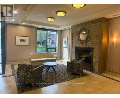 A living room with a fireplace and a couch.