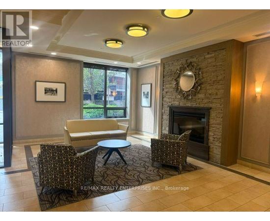 A living room with a fireplace and a couch.