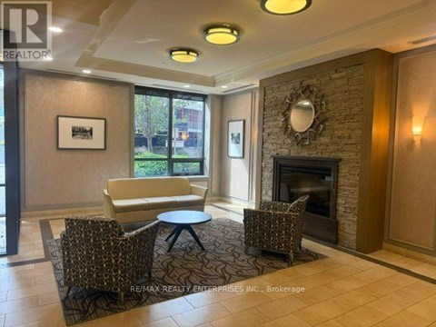 A living room with a fireplace and a couch.