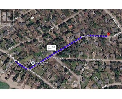 A map with a blue dotted line and a red marker indicating a route.
