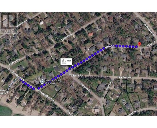 A map with a blue dotted line and a red marker indicating a route.