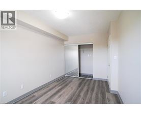 A room with a wooden floor and white walls.