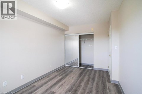 A room with a wooden floor and white walls.