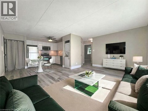 A living room with a green couch and a coffee table.