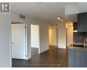 A modern kitchen with a sink and a countertop.