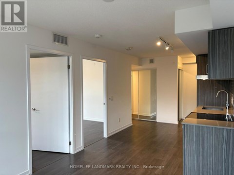 A modern kitchen with a sink and a countertop.
