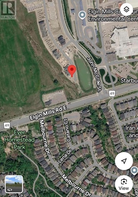 A map shows a red pin on a street named John Mccarthy.