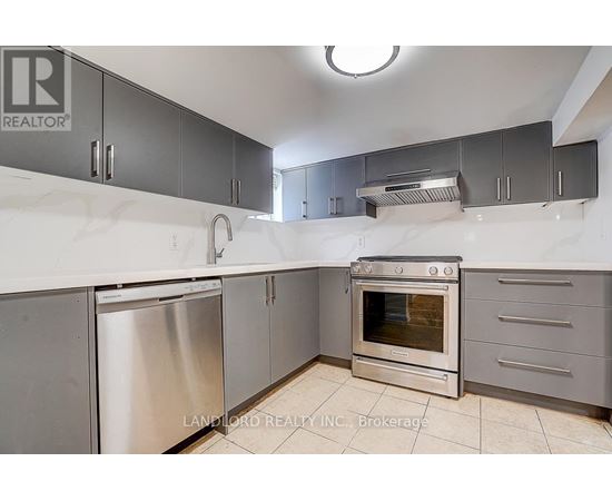 A kitchen with a stainless steel dishwasher and oven.