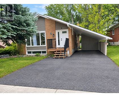 A house with a driveway in front of it.