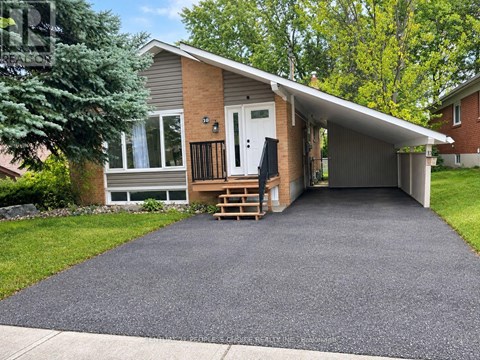 A house with a driveway in front of it.