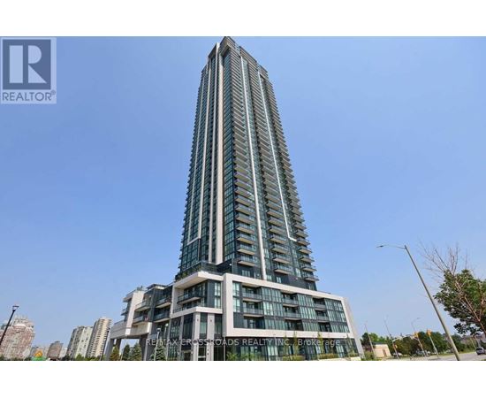 A tall building with many windows and a sign that says "REALTOR" on it.
