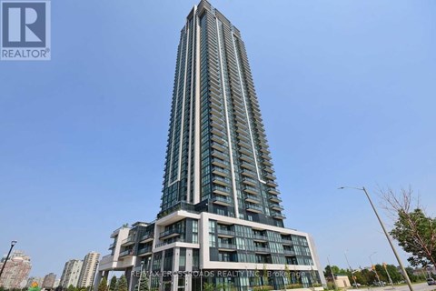 A tall building with many windows and a sign that says "REALTOR" on it.