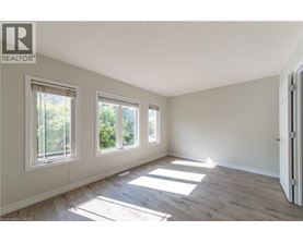 A room with a window and a door.