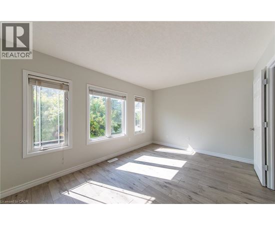 A room with a window and a door.
