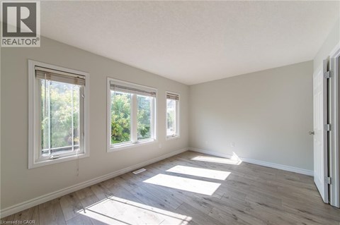 A room with a window and a door.
