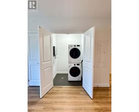 A laundry room with a washer and dryer in it.