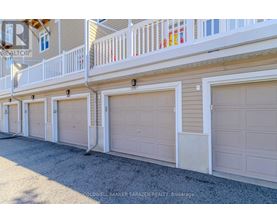 A row of garage doors in front of a building.