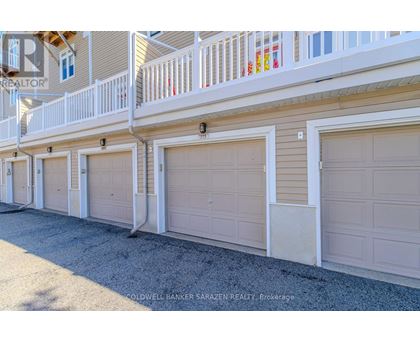 A row of garage doors in front of a building.