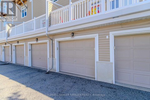 A row of garage doors in front of a building.