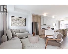 A modern living room with a grey sofa and a wooden coffee table.