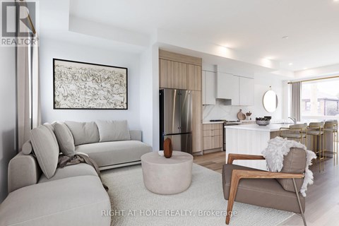 A modern living room with a grey sofa and a wooden coffee table.