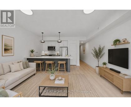 A modern living room with a sofa, coffee table, and a television.