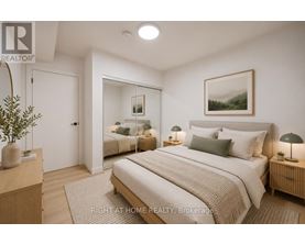 A bedroom with a large bed and a mirror on the wall.
