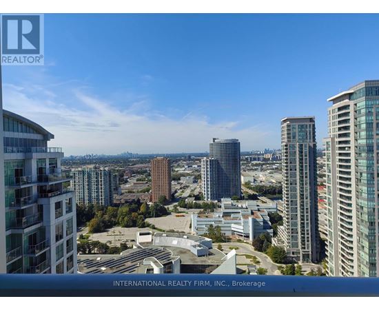A cityscape with tall buildings and a clear sky.