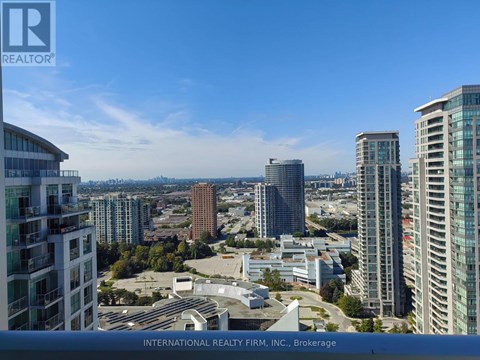 A cityscape with tall buildings and a clear sky.