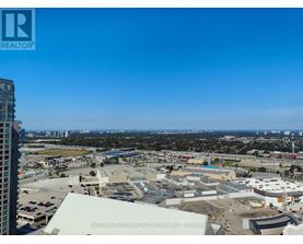 A view of a cityscape with a building in the foreground that has the words "International Realty Firm, Inc." on it.