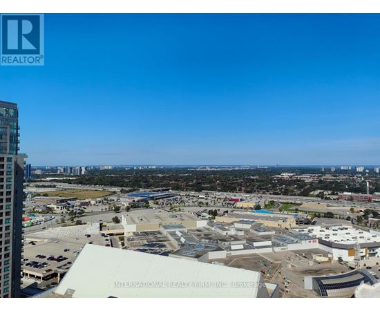 A view of a cityscape with a building in the foreground that has the words "International Realty Firm, Inc." on it.