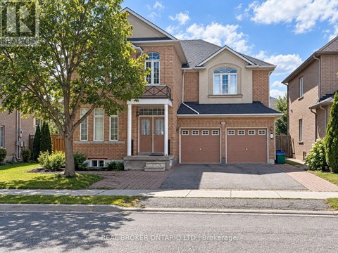 A two-story house with a brick facade and a large front yard.