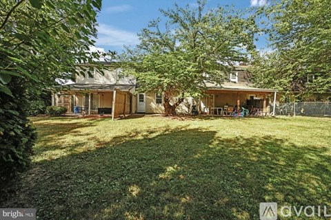 A house with a yard is for sale.